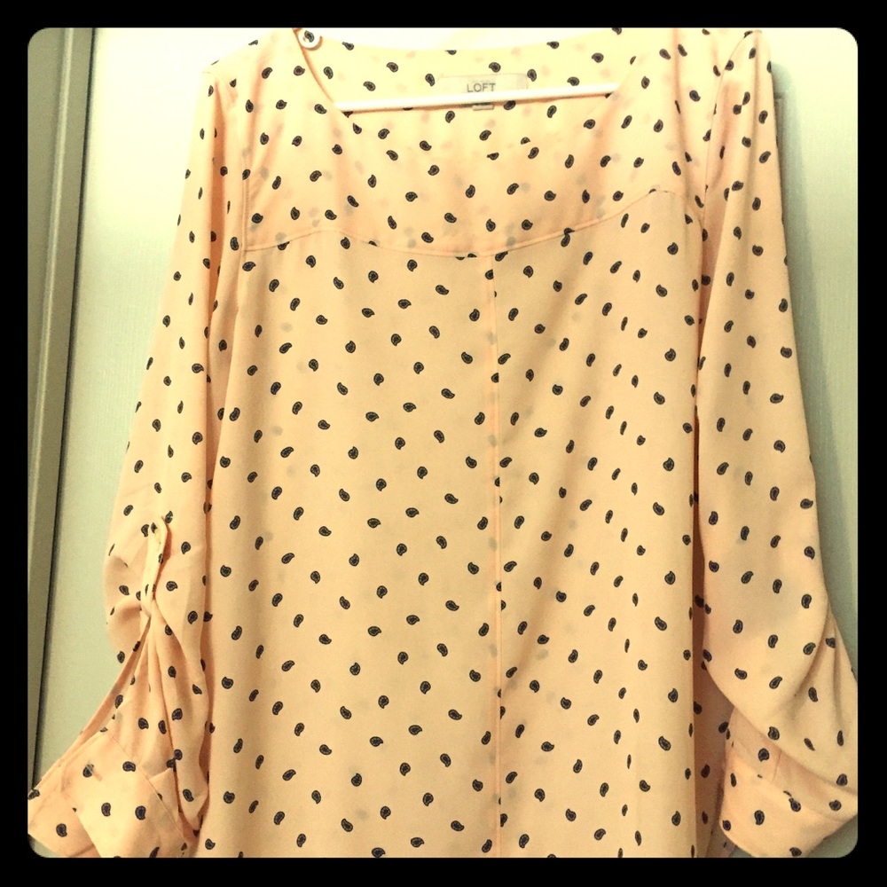 Blush top with navy pattern.